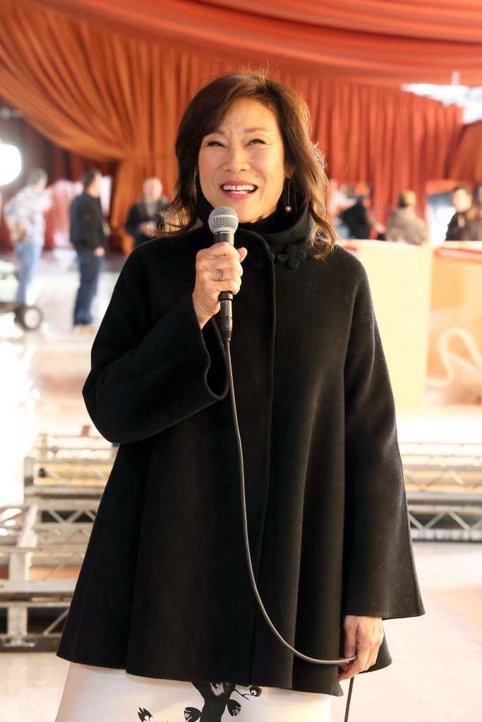 Janet Yang holding a mic