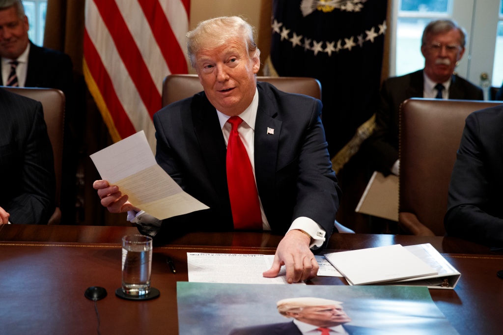 President Donald Trump holds up a letter he says is from North Korean leader Kim Jong Un during a cabinet meeting at the White House, Wednesday, Jan. 2, 2019, in Washington.