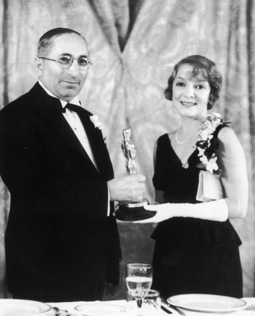Louis B. Mayer presents the Best Actress Oscar to Helen Hayes in 1932.