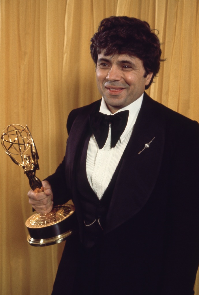 Robert Blake holding Emmy