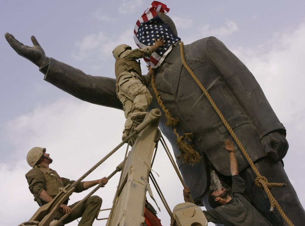 US troops tear down a statue of Saddam Hussein in Iraq in March 2003. 