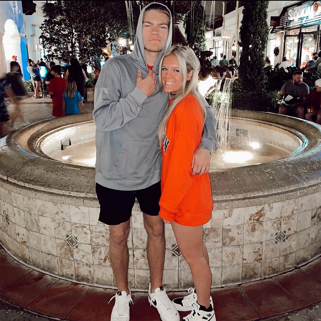 Elijah DeWitt is seen with his girlfriend Bailey Reidling in an undated family photo. DeWitt, a standout receiver for Jefferson High School in Georgia, was gunned down outside the chain restaurant in the parking lot of the Sugarloaf Mills Mall Wednesday, Oct. 5, 2022.
