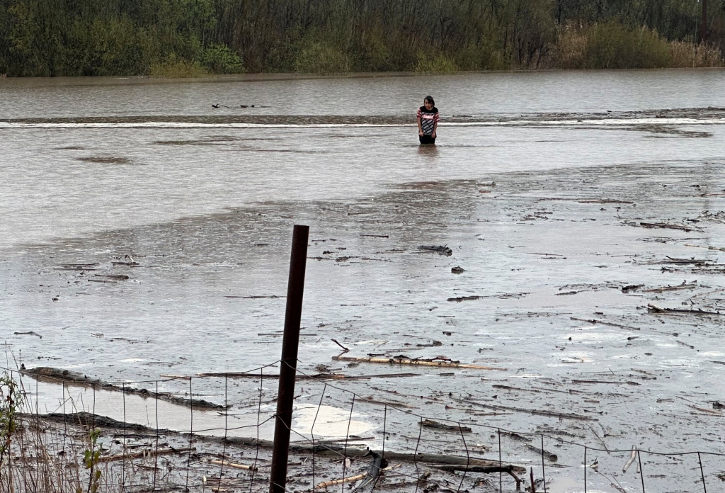 Hernandez is pictured in the murky waters.