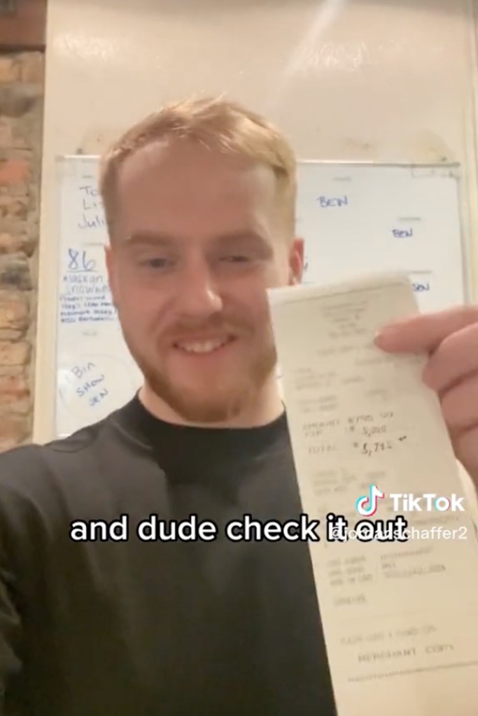 Server Jordan Schaffer holding a receipt