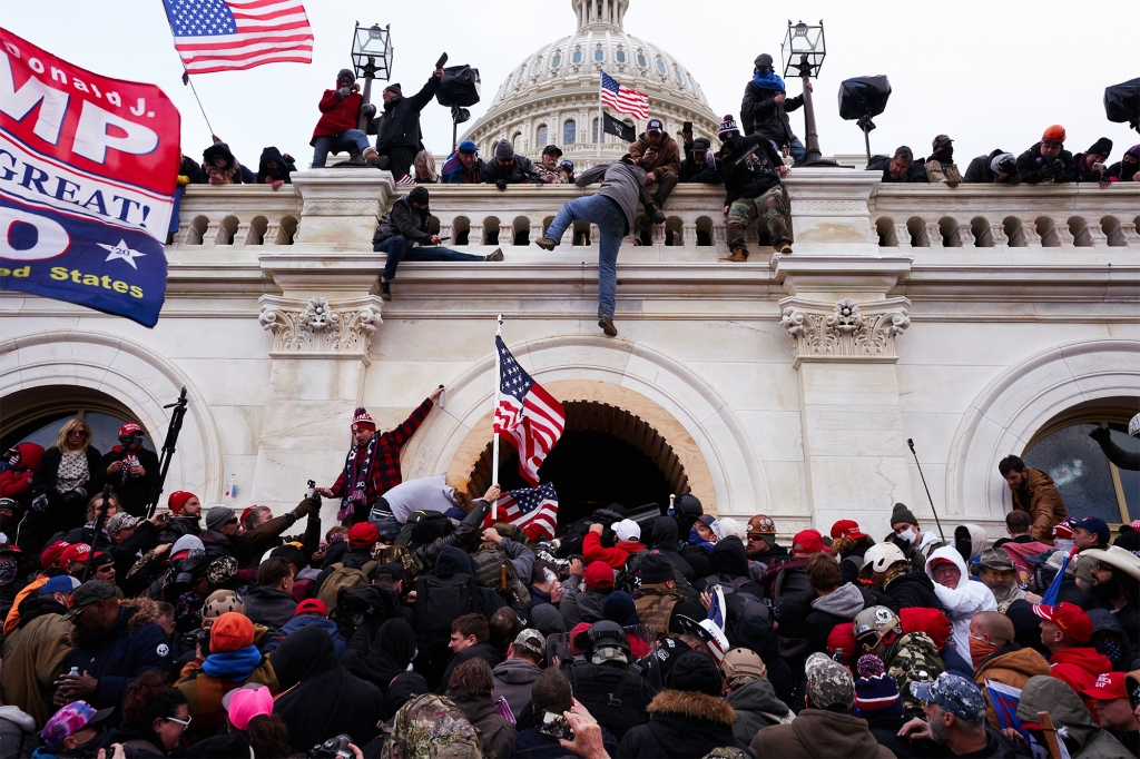 A mob of pro-Trump supporters clash with law enforcement agents at the US Capitol on Jan. 6, 2021. 
