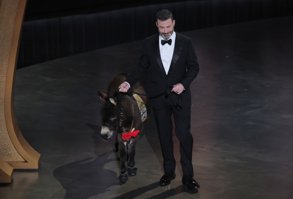 Jimmy Kimmey with a donkey onstage. 