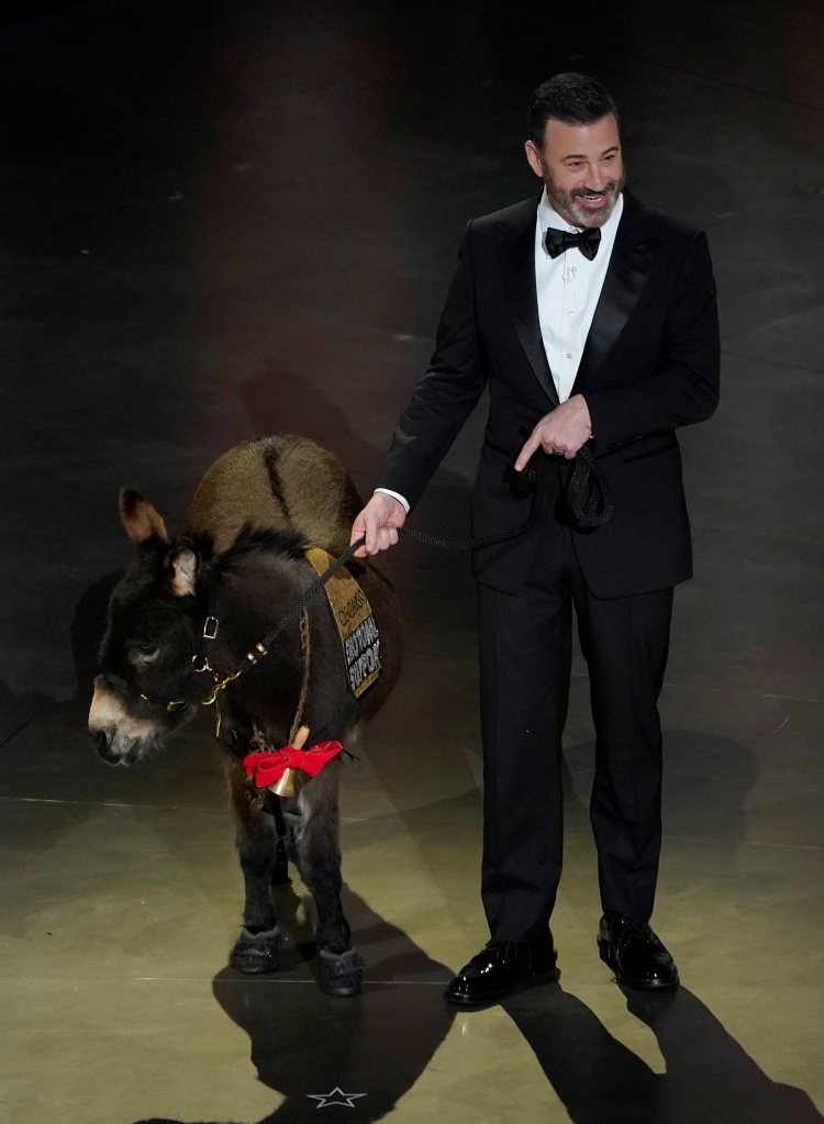 Jimmy Kimmel walks onstage with Jenny, the miniature emotional support donkey, at the Oscars on Sunday, March 12, 2023,