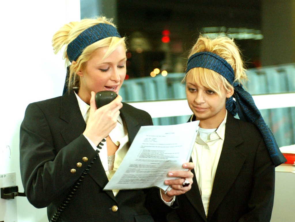 Paris Hilton and Nicole Richie in an episode of their 2003 reality show "The Simple Life" posing at an airport.