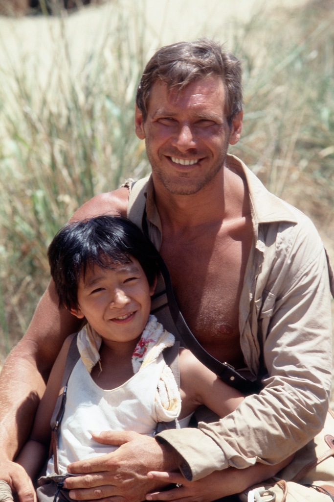 Harrison Ford and Ke Huy Quan on the set of "Indiana Jones and the Temple of Doom."