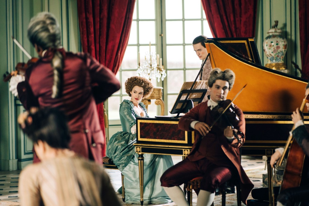 A woman plays the piano while a man plays the violin in "Marie Antoinette." 