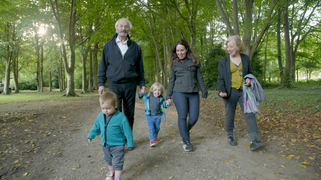 Julian Assange's wife, Stella, walks with his father, John Shipton, and her two sons, Gabriel and Max.