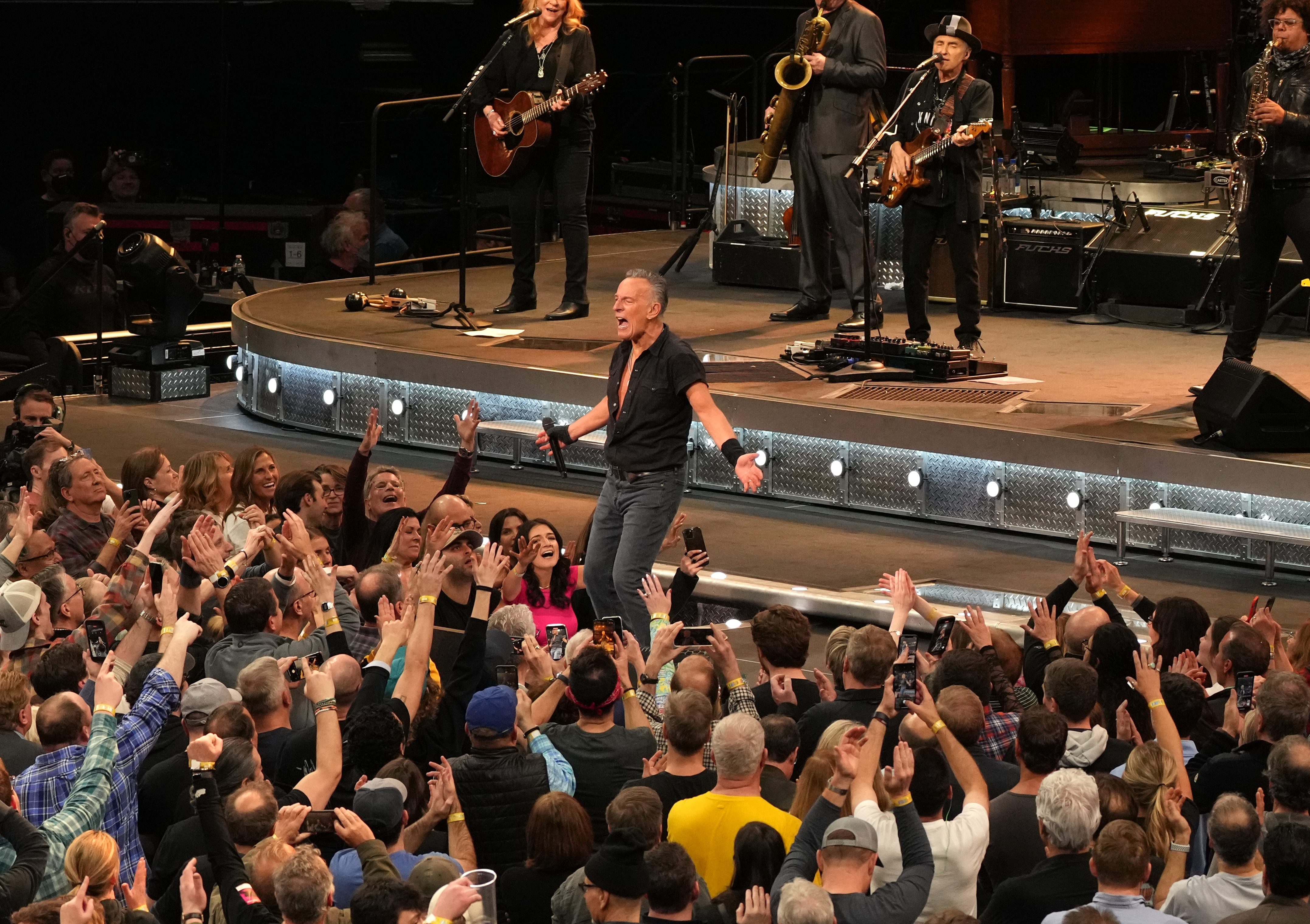 Springsteen and the E Street Band performing live. 