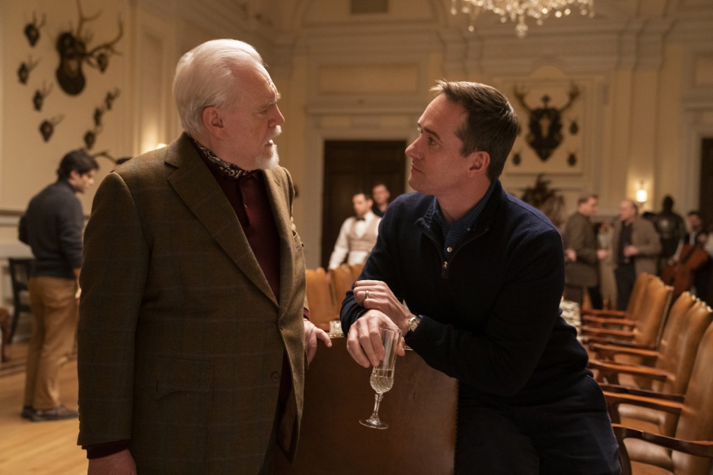 Logan (Brian Cox) and his son-in-law, Tom (Matthew Macfadyen) in "Succession" talking in a crowded room. 