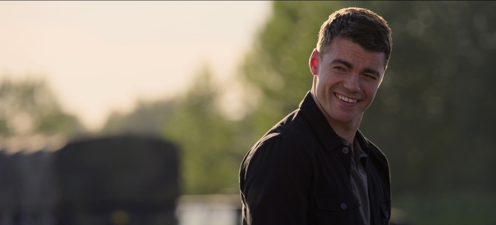 Peter (Gabriel Basso) smiling in "The Night Agent." 