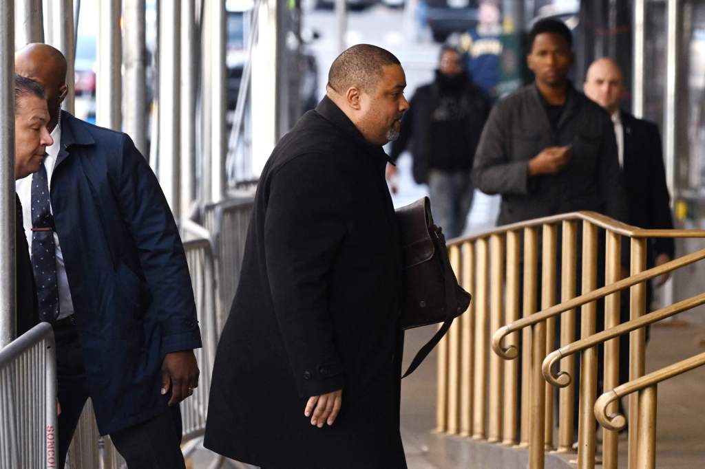 Manhattan District Attorney Alvin Bragg (C) arrives at the Manhattan District Attorney's office in New York City.