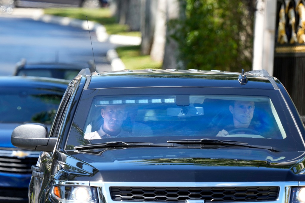 The motorcade of former President Donald Trump leaves his Trump International Golf Club in West Palm Beach, Florida