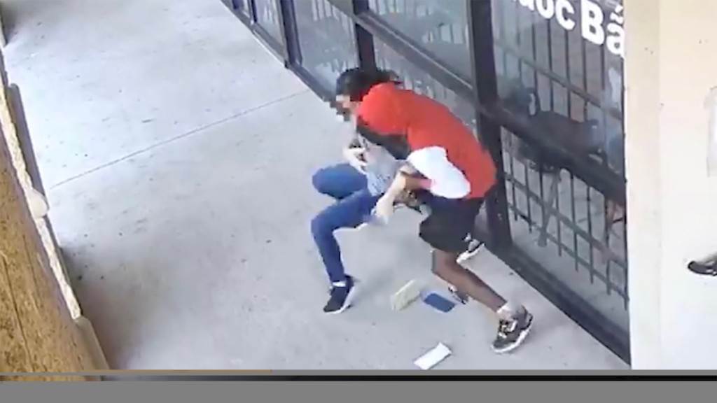 The violent robbery was caught on video, showing victim Nhung Truong being slammed to the ground. 