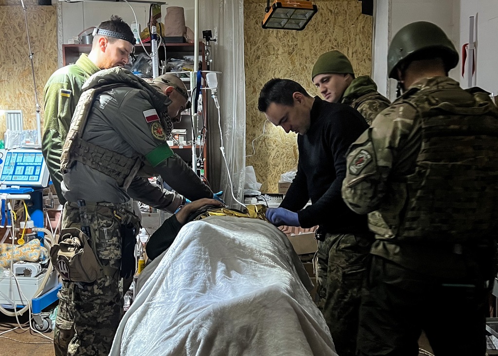 Medics treating Ukrainian soldier. 