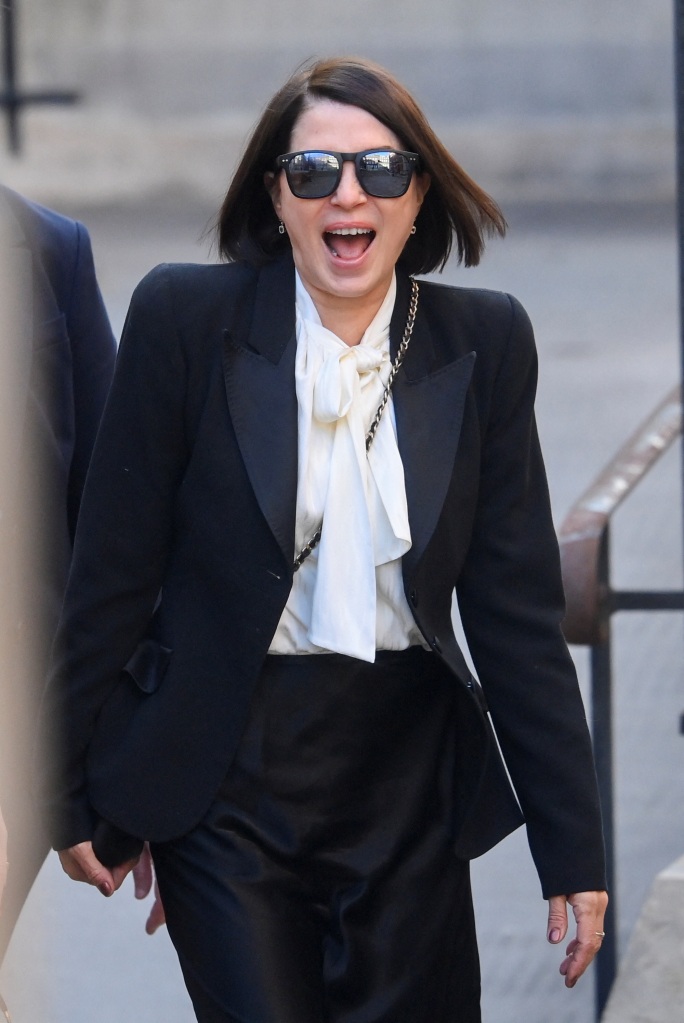 Sadie Frost laughs while arriving at court.