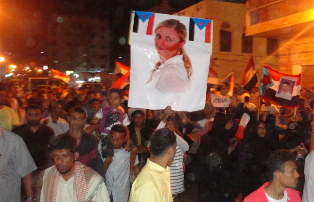 Protestors in Yemen hold a picture of Martine in 2012 as they oppose Shahir Abdulhak's business dealings.