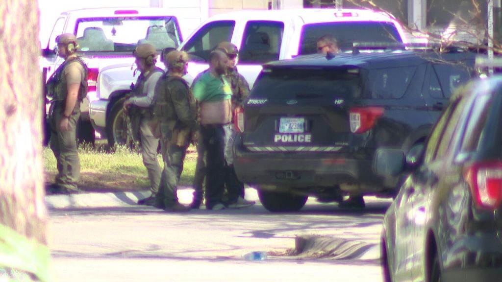 Jake Harris being arrested after an hours-long standoff