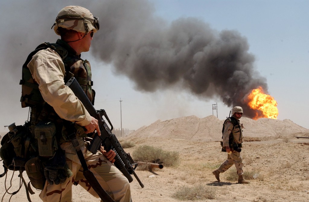 US Army troops burning oil well in the Rumaylah Oil Fields on April 2, 2003.