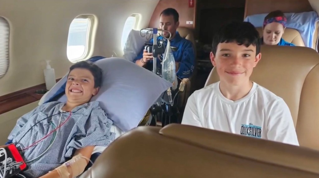 Dillon with his family on the medical plane.