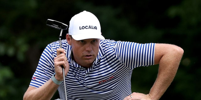 Nick Watney of the U.S. lines up a putt on the eighth green during the final round of the Rocket Mortgage Classic at Detroit Golf Club July 31, 2022, in Detroit.