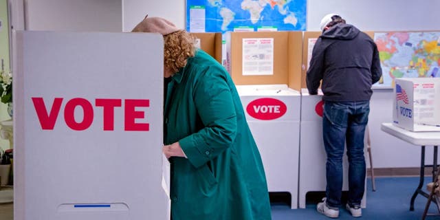 People fill out ballots at Northwest Baptist Church in Oklahoma City Feb. 14, 2023. 