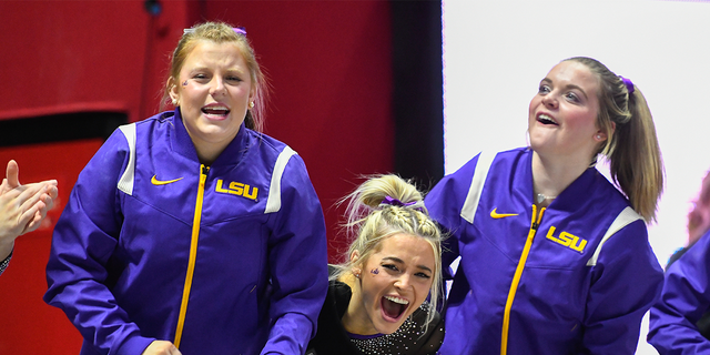 Olivia Dunne of LSU and her teammates cheer during a PAC-12 meet against Utah at Jon M. Huntsman Center on Jan. 6, 2023 in Salt Lake City.