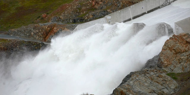 Water flows down Oroville Dam's main spillway in Oroville, Calif., Friday, March 10, 2023. Lake Oroville — one of the most important reservoirs in the state and home to the nation's tallest dam — has so much water that officials on Friday opened the dam's spillways for the first time since April 2019. The reservoir's water has risen 180 feet (54.8 meters) since Dec. 1. 