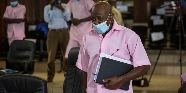 FILE - Paul Rusesabagina, who inspired the film "Hotel Rwanda" and is credited with saving more than 1,000 people by sheltering them at the hotel he managed during the genocide, attends a court hearing in Kigali, Rwanda, Friday Feb. 26, 2021. 