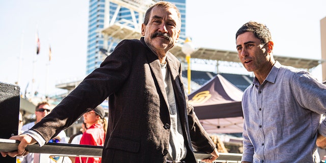 San Diego Padres chairman Peter Seidler and president of baseball operations and general manager A.J. Preller talk during the San Diego Padres' Fan Fest at PETCO Park Feb. 4, 2023, in San Diego.