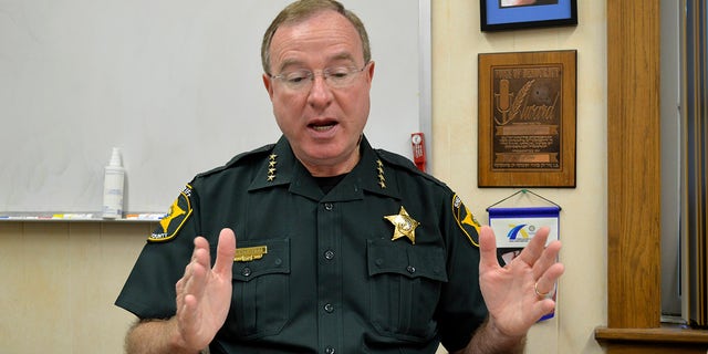 Polk County Sheriff Grady Judd was speaking at a church service on March 12 when a murder suspect was arrested. 