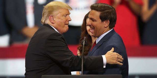 Florida Gov. Ron DeSantis with former President Donald Trump at a rally. 