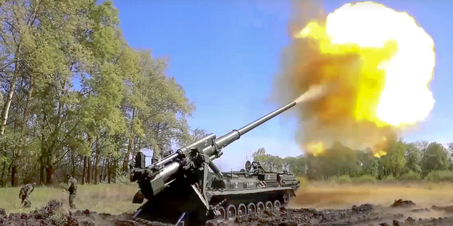 In this handout photo released by Russian Defense Ministry Press Service released on Sunday, June 5, a Pion artillery system of the Russian military fires at a target in an undisclosed location in Ukraine. 