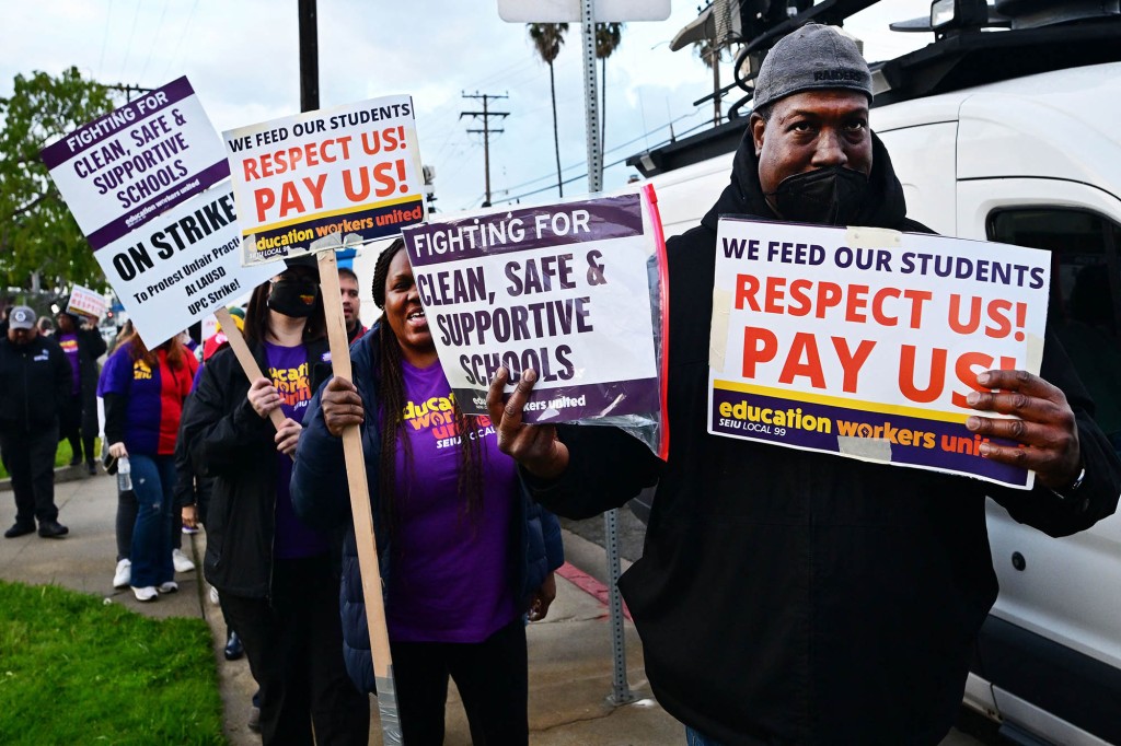 People protest for the third day as members of the Service Employees International Union Local 99 strike, in Los Angeles, California on March 23, 2023