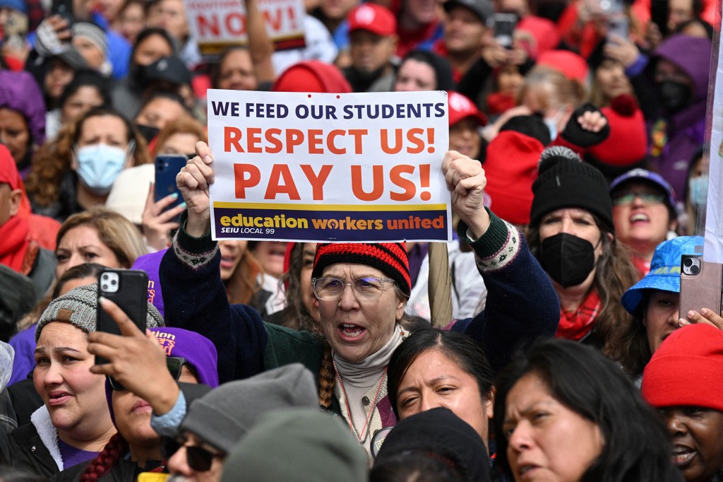 Los Angeles public school support staff, teachers, and supporters rally outside of the school district headquarters on the first day of a three day strike in Los Angeles, California, on March 21, 2023.