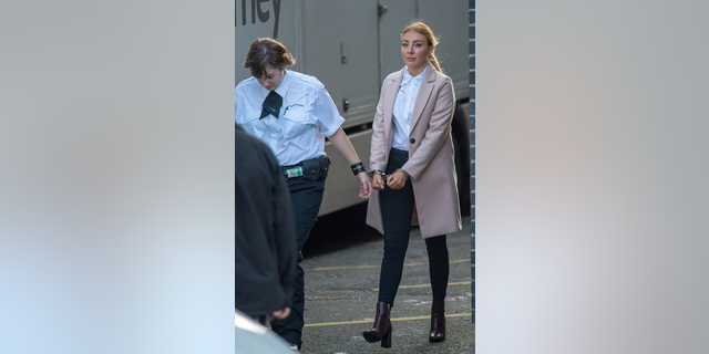 Former prison guard Ayshea Gunn in handcuffs. 