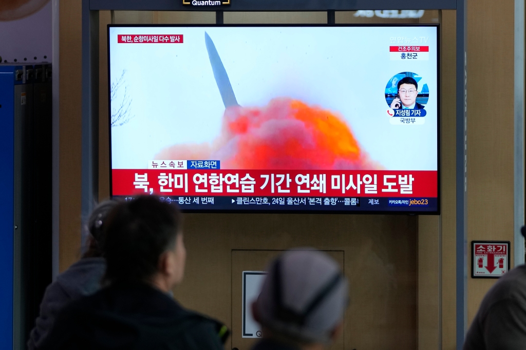 More people watch the TV screen reporting on the latest missile launch at the Seoul Railway Station in Seoul, South Korea, on March 22, 2023.  