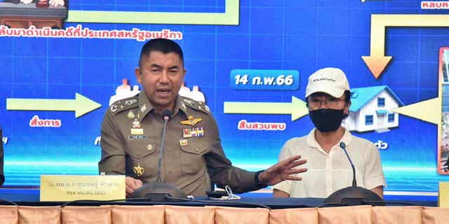 Deputy National Police Chief Surachet Hakpal, left, talks to reporters with Tubtim "Sue" Howson, 57, during press conference at police headquarter in Bangkok, Thailand, Wednesday, Feb. 15, 2023. Howson allegedly struck Michigan State University student Benjamin Kable, 22, shortly before dawn on Jan. 1. She flew to Thailand on a one-way ticket on Jan. 3, according to U.S. authorities.