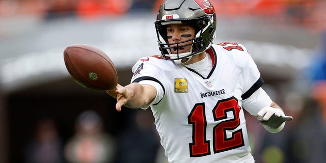 Tampa Bay Buccaneers quarterback Tom Brady gets of a shovel pass during the first half of an NFL football game against the Cleveland Browns in Cleveland, Sunday, Nov. 27, 2022.