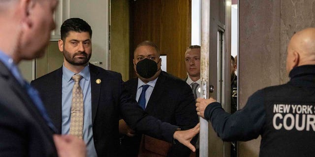 Manhattan District Attorney Alvin Bragg exits Manhattan Criminal Court in New York on Friday.