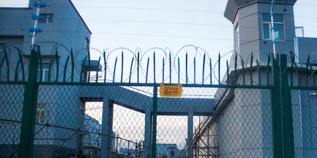 A perimeter fence is constructed around what is officially known as a vocational education center in Dabancheng in Xinjiang province, China Sept. 4, 2018.