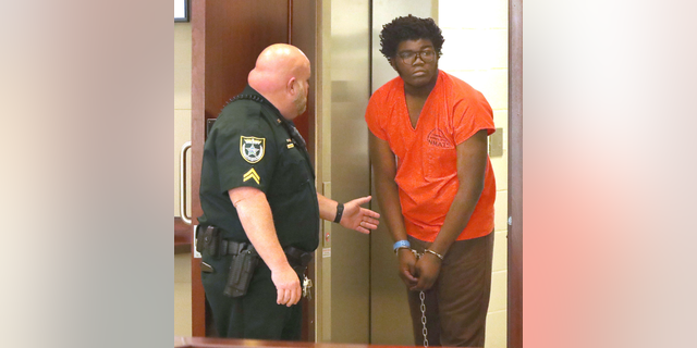 Brendan Depa looks around as he enters the courtroom, Thursday March 9, 2023 for a hearing before Judge Chris France, at the Kim C. Hammond Justice Center in Bunnell, where Joan Naydich is seeking a permanent injunction against the Matanzas High School student accused of attacking her. 