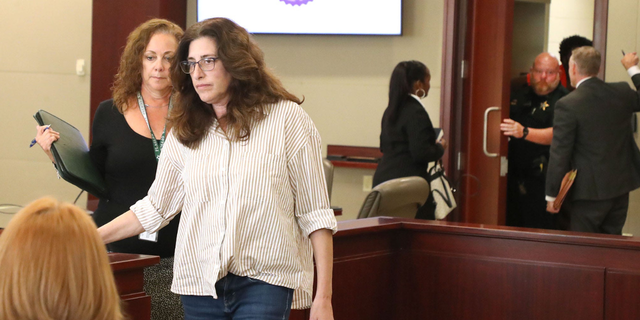 Joan Naydich walks with her council as Brendan Depa is escorted back to the holding cells, Thursday March 9, 2023 following a hearing before Judge Chris France, at the Kim C. Hammond Justice Center in Bunnell, where Naydich is seeking a permanent injunction against the Matanzas High School student accused of attacking her.