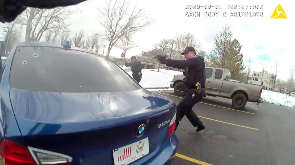 Police body-worn camera footage shows officers hold up their weapons during the traffic stop on March 1, 2023, in Farmington, Utah.