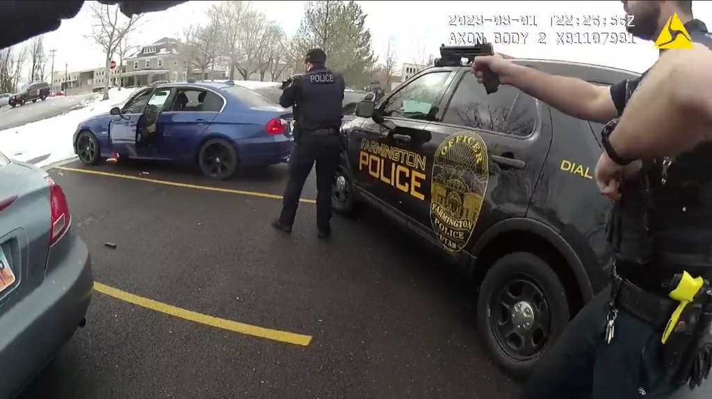 Chase Allan eventually provided a passport, but refused to leave the car after a demand from the officer.