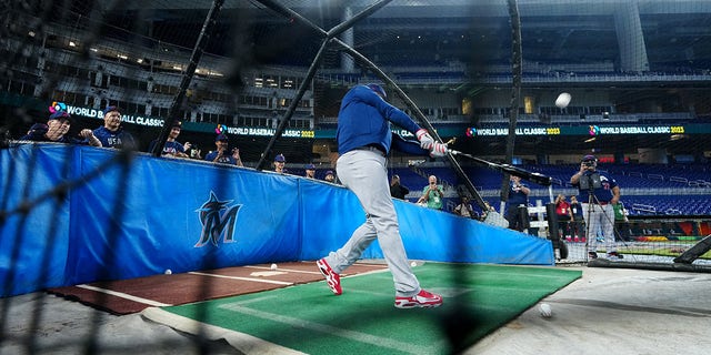 Team USA looks on as hitting coach Ken Griffey Jr. takes batting practice during the Team USA workout prior to the 2023 World Baseball Classic Quarterfinal game between Team Puerto Rico and Team Mexico at loanDepot Park on Friday, March 17, 2023, in Miami, Florida. 