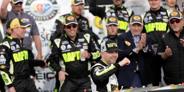 William Byron (24) celebrates with his team after winning a NASCAR Cup Series auto race on Sunday, March 5, 2023, in Las Vegas. 